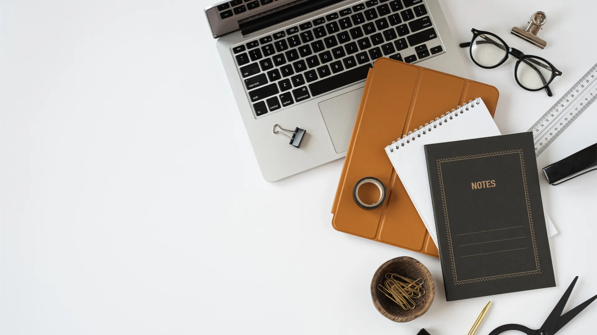 Laptop, notebook and stationery representing Shiv Om E-Tec news and events