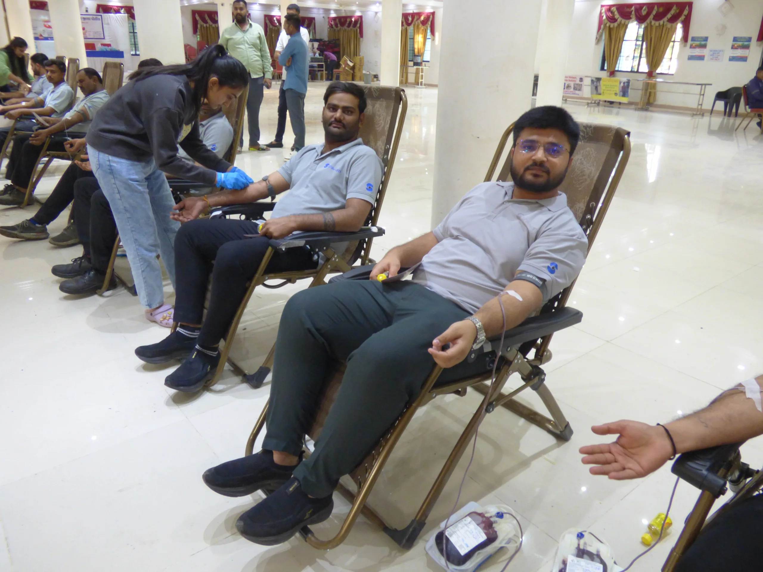 Shiv Om at Jamnagar Blood Donation Camp Group photo of Shiv Om team members donating blood.